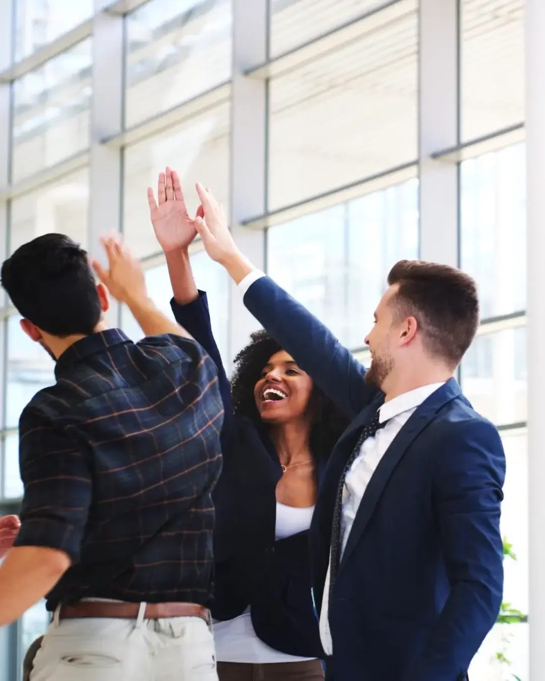 business team high fiving