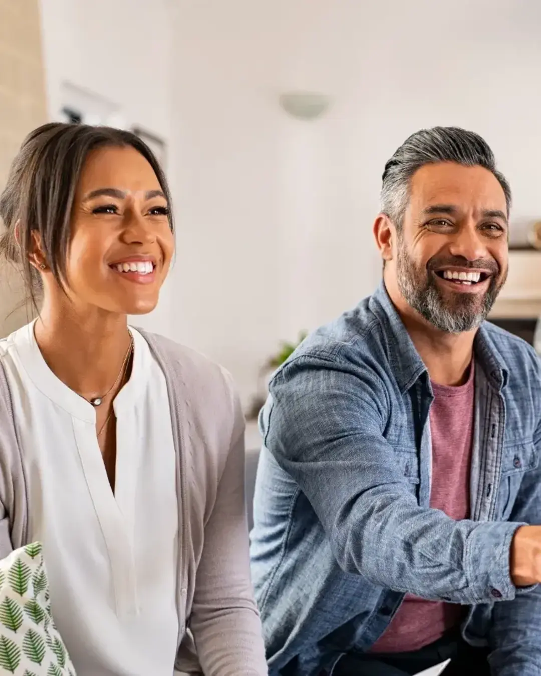 Couple shaking hands with professional and smiling